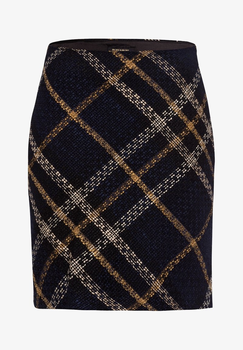Jupe bleu marine longueur genou avec un tissu texturé et un motif à carreaux beige et marron à grande échelle.