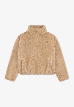 Giacca in pile sherpa beige con zip integrale, collo alto e due tasche anteriori, mostrata distesa su sfondo bianco.