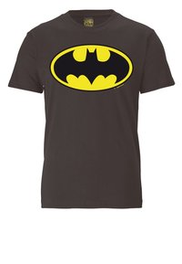 Black cotton t-shirt featuring a large, oval yellow Batman logo at the center. Short sleeves, round neckline, standard fit.