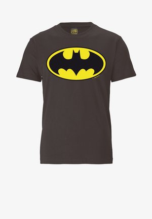Black cotton t-shirt featuring a large, oval yellow Batman logo at the center. Short sleeves, round neckline, standard fit.