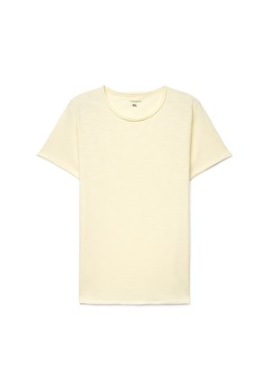 Maglietta in cotone color crema a maniche corte con scollo rotondo, taglia XL, distesa su uno sfondo bianco.
