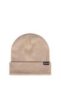 Beige knit beanie with a rolled cuff, made from soft material. Features a small branded tag on the side.