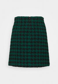 Zelená a černá sukně s houndstooth vzorem vyrobená z texturované tkaniny, se střihem do rovného tvaru a zapínáním na zip na zadní straně.
