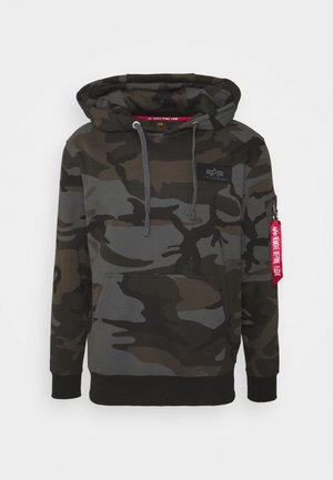 Camo hoodie in shades of dark green and gray, featuring a front kangaroo pocket, drawstring hood, and a zip pocket with a red tag.