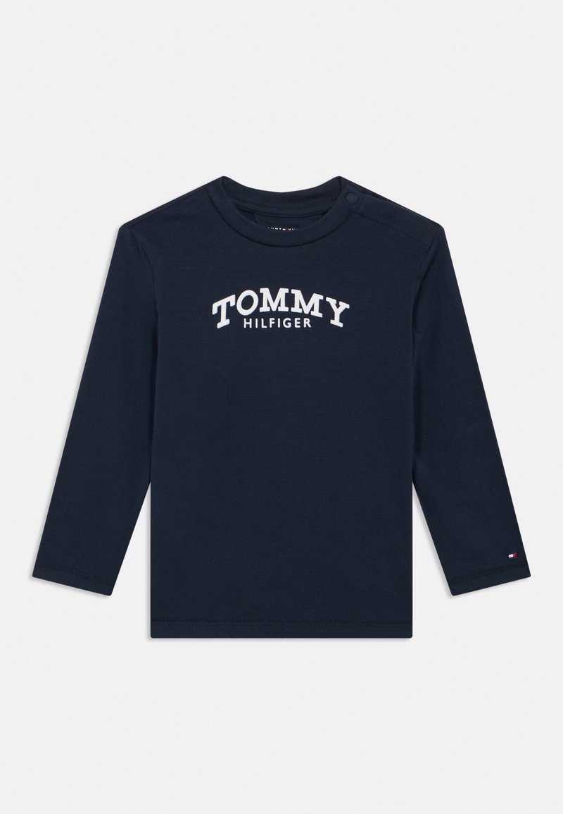 Tengerészkék hosszú ujjú kisgyermek ing fehér "TOMMY HILFIGER" felirattal az elején és kis logóval a bal ujj mandzsettáján.
