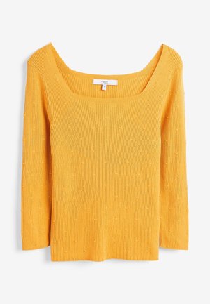 Yellow ribbed knit top with 3/4 sleeves, square neckline, and textured dots throughout the fabric. Brand label "next" visible inside.