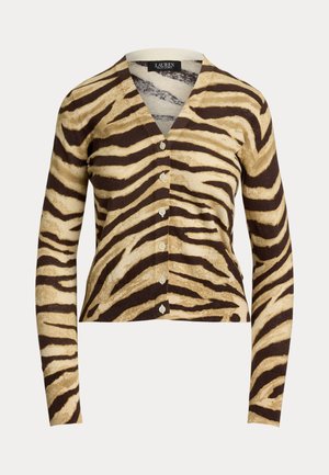 Ruskea ja kerma raidallinen zebra-neule, jossa on V-kaula-aukko, pitkät hihat ja kuusi etupainiketta. Valmistettu pehmeästä, kevyestä materiaalista.