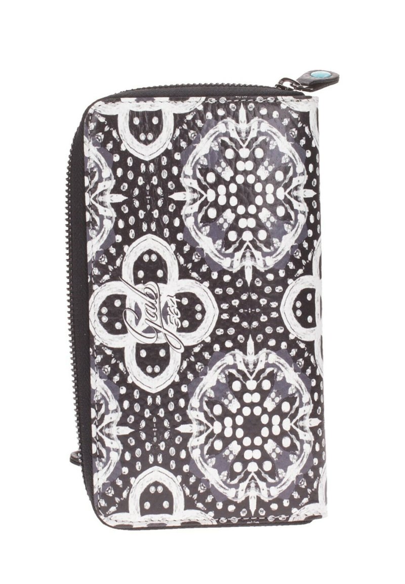Portefeuille à motifs noir et blanc avec des motifs floraux, présentant une surface texturée et une fermeture à glissière. Accentué avec un tirette de fermeture éclair turquoise.