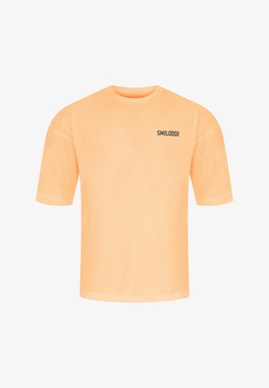 Korte mouwen oranje T-shirt van katoen, met een ronde halslijn en een zwart "SMILODOX" logo bedrukt aan de linkerkant.