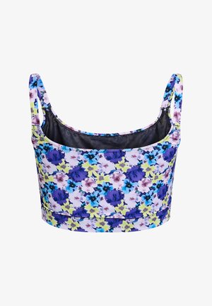 Blomster crop top med tynde stropper, der har et flerfarvet mønster af lilla, blå og gule blomster på en lys baggrund.