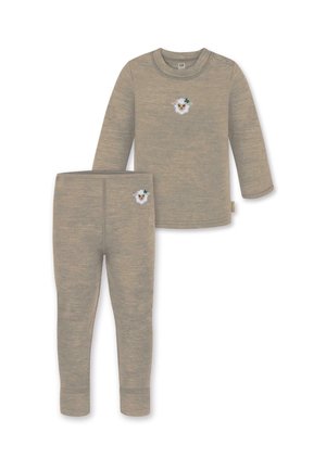 Tan long-sleeve top and matching leggings in soft fabric, featuring a sheep graphic with a clover on the chest and thigh.