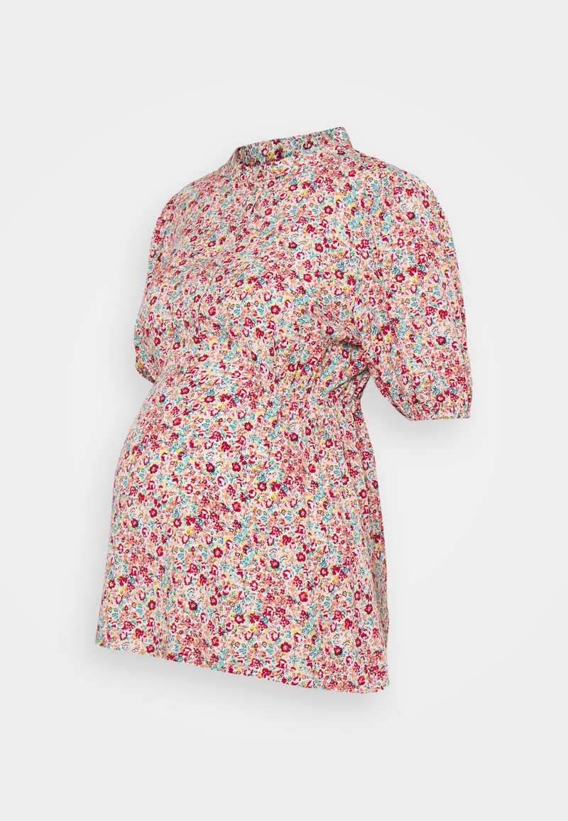 Blouse de maternité à manches courtes avec petit imprimé floral rouge, rose, jaune et bleu, taille froncée pour le confort.