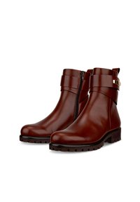 Braune Lederstiefeletten verfügen über einen seitlichen Reißverschluss, breite Riemen und eine strukturierte Gummisohle für guten Halt. Glatte Oberfläche mit stabiler Bauweise.
