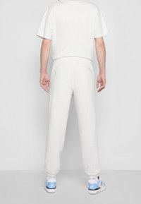 New Balance Pantalones deportivos - mottled light grey