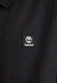 Timberland BADGE COACH JACKET - Vasaras jaka - black