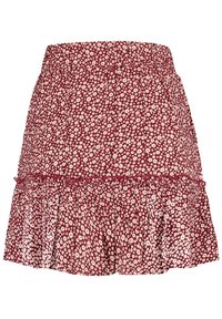 Červená mini sukně s bílým květinovým potiskem, elastickým pasem a volánkovým lemem.