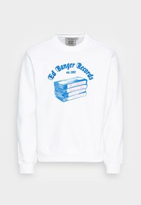 Felpa bianca con stampa grafica blu di cassette impilate, con testo che recita "Ed Banger Records est. 2003" e titoli di album.