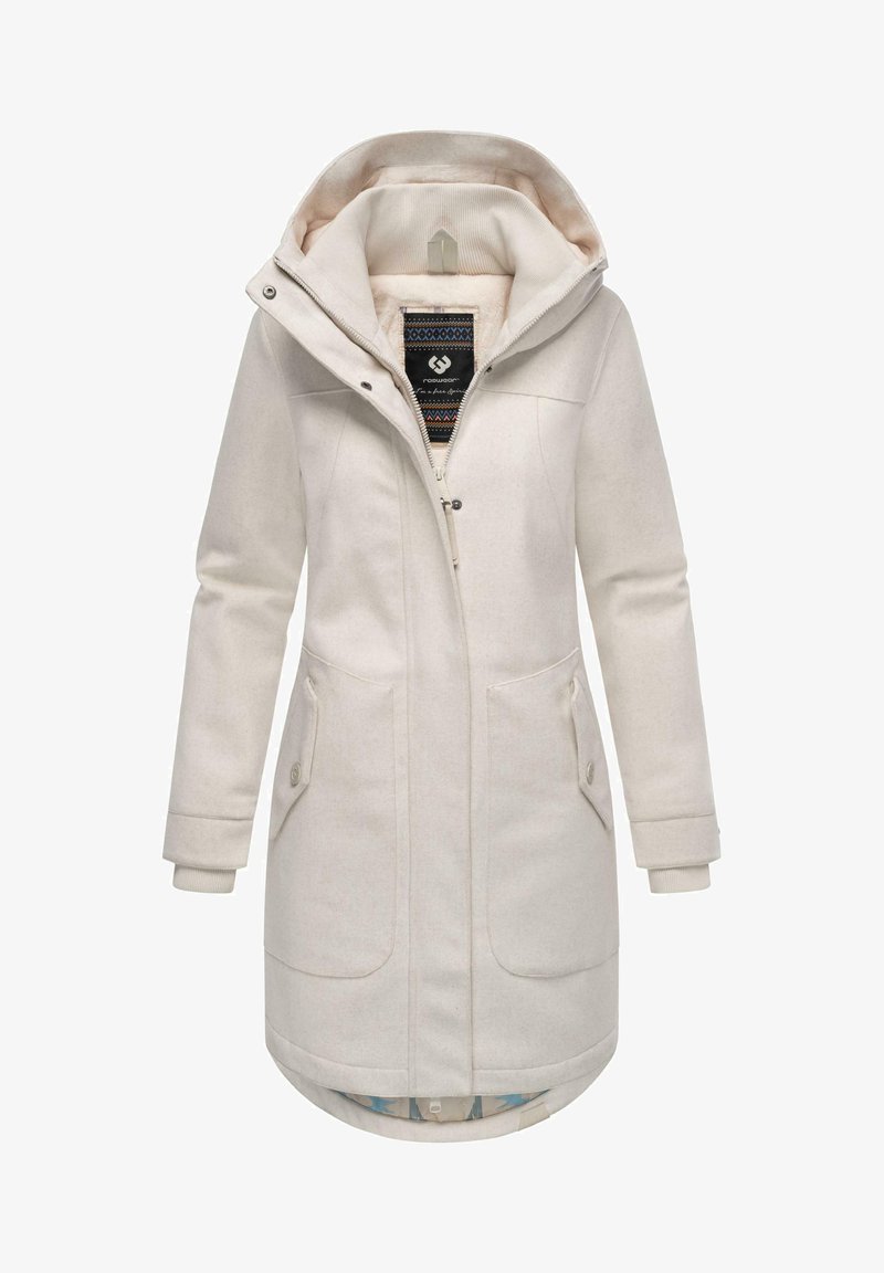 Beige lang frakke med hætte, lavet af blødt stof. Har en lynlås lukning, to forlommer og en mønstret inderside.