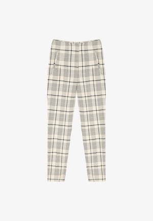 Rute bukser i creme og sort, med sidelommer, lige ben design og en glat overflade.