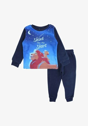 Haut de pyjama bleu à manches longues avec des graphiques de lion et le texte "brille comme les étoiles", associé à un pantalon en polaire marine. Matériau doux et confortable.
