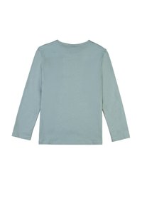 Langärmliges Hemd in Hellblau, aus weichem Stoff. Hoher, runder Halsausschnitt, gerader Schnitt und einfache Stichdetails entlang der Säume und Ärmel.