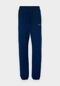 Marineblauwe sweatpants van zachte stof. Heeft een elastische tailleband, aangesloten enkels en een gouden "7 DAYS ACTIVE" logo aan de zijkant.