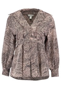 Blouse à manches longues couleur crème avec motif abstrait en zigzag noir, dotée d'un col en V et d'une taille froncée pour une coupe structurée.