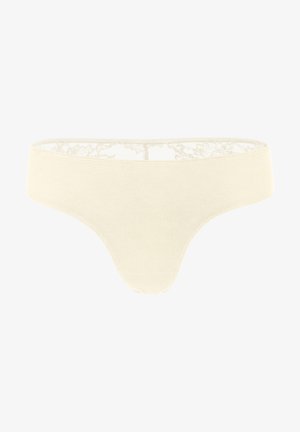 Perizoma in misto cotone color crema chiaro con pizzo sul punto vita, caratterizzato da una texture morbida e un design senza cuciture per il massimo comfort.