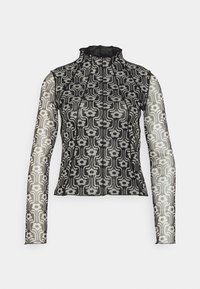 Haut à manches longues noir avec une conception transparente, orné d'un motif floral en blanc et gris. Col montant avec des accents en tissu texturé.