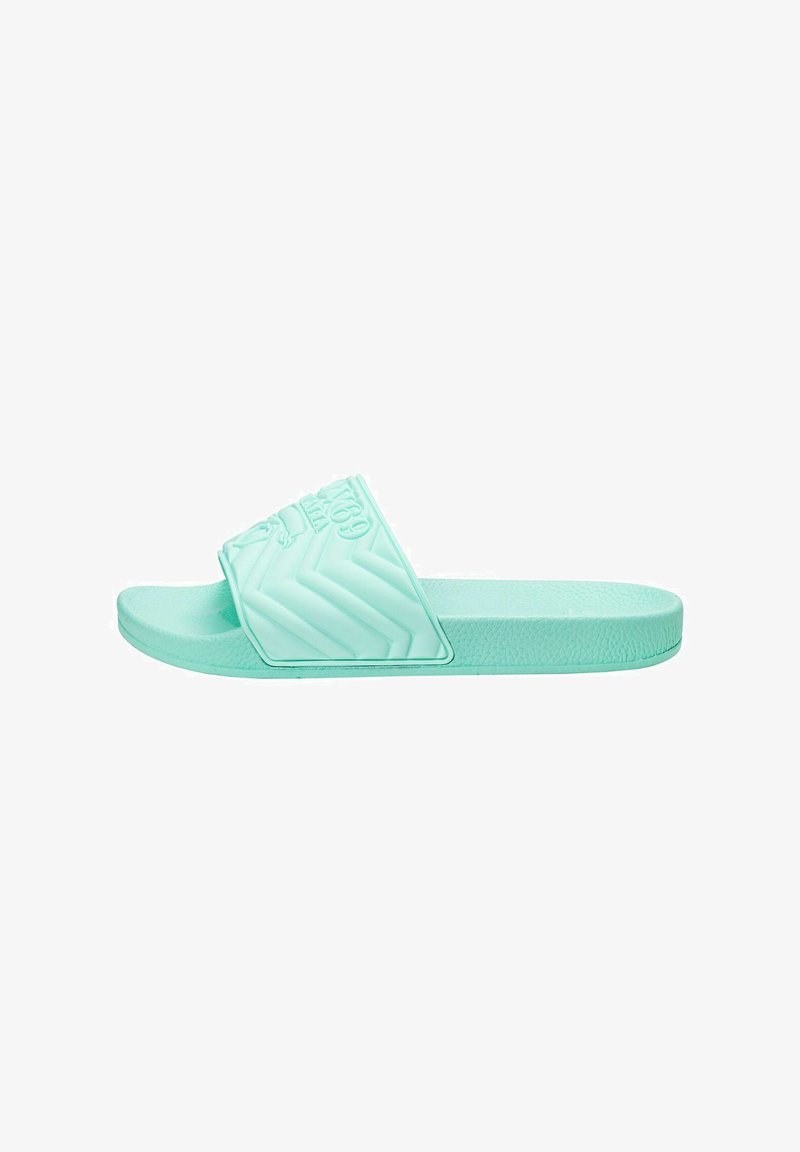 Mint green slide sandal with a textured strap featuring a chevron pattern. Made of flexible material with a flat sole.