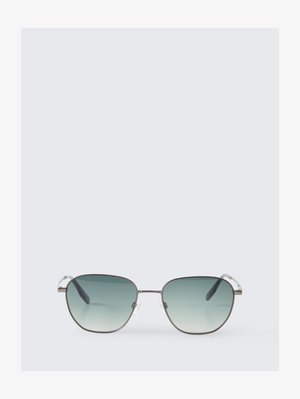 Square-shaped sunglasses with thin silver metal frames and gradient green lenses on a light gray background.
