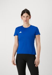 Blue athletic t-shirt made of lightweight fabric, featuring a round neck, short sleeves, and a white logo on the left chest.