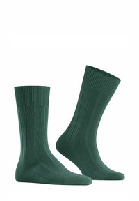 Calcetines de algodón verde acanalados de longitud media, con un diseño texturizado y puntera y talón reforzados para mayor durabilidad.