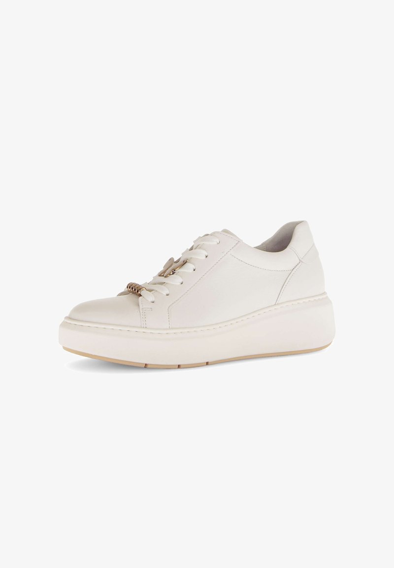 White leather sneakers feature a rounded toe, thick white sole, and laces with gold hardware accents, providing a smooth texture and modern design.