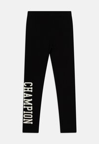 Leggings neri realizzati in tessuto elastico, con la scritta "CHAMPION" stampata in bianco sulla gamba sinistra. Texture liscia e design aderente.