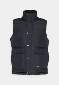 Svart puffärmad väst med hög krage, tryckknappsstänger och två stora framfickor. Tillverkad av mjukt, vattenavvisande material.