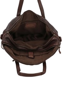 Brown leather handbag with open zipper showing empty fabric-lined interior and multiple compartments.