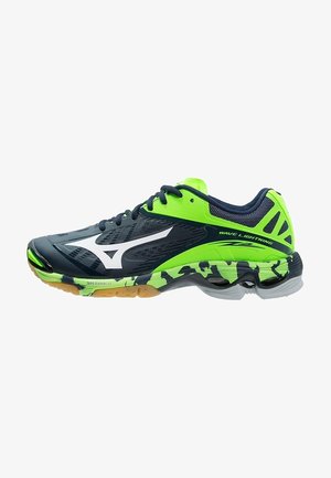 Zapatilla deportiva azul oscuro y verde neón con acentos en negro y blanco, etiquetada como "Wave Lightning", con suela estampada y diseño con cordones.