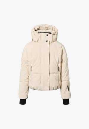 Veste matelassée couleur crème avec une capuche, des boutons-pression, deux poches avant zippées et des poignets côtelés. Texture lisse et matelassée.