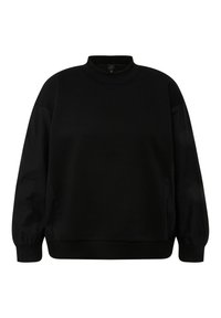 Sudadera negra con cuello alto, mangas largas y puños acanalados. Tela de algodón suave con un corte holgado, que incluye aberturas laterales para mayor comodidad.