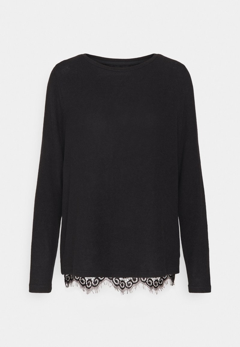 T-shirt noir à manches longues avec un col rond et un ourlet décoratif en dentelle noire présentant un bord festonné et des motifs élaborés.