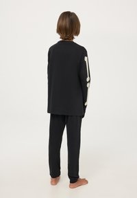 Terranova SET CON SCHELETRO CHE SI ILLUMINA - Pigiama - nero