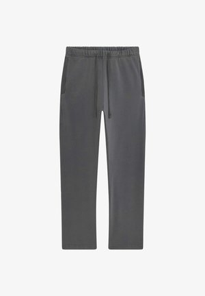 Pantalon de survêtement gris foncé avec taille élastique, cordon de serrage et détails côtelés sur les poches latérales.