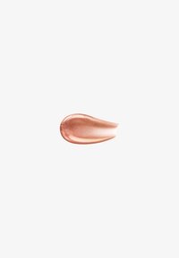 Shimmering rose gold cosmetic cream swatch with smooth texture on a white background.