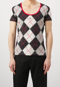 Short-sleeve T-shirt in black, grey, and white argyle pattern with red outline. Features a small embroidered logo on the chest.