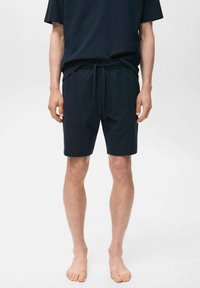 Marineblaue Shorts mit elastischem Bund, Kordelzug-Detail und lockerer Passform. Aus einem weichen, strukturierten Stoff für hohen Komfort.