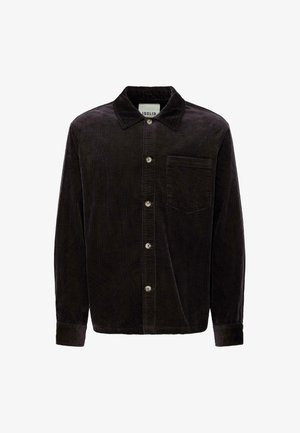 Sort corduroy skjorte med krave, forlommer og knaplukning. Det teksturerede stof har lodrette ribber og en underliggende glans.