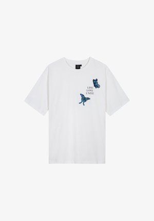 Witte katoenen t-shirt met blauwe geborduurde vlinders en de tekst "LEEF LIEFDE VERENIG". Korte mouwen, ronde hals, ontspannen pasvorm.