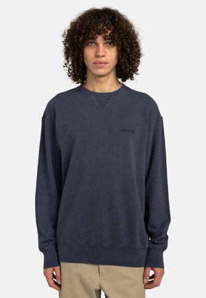Granatowy sweatshirt z długimi rękawami i ściągaczami. Posiada okrągły dekolt oraz subtelne logo na piersi. Wykonany z miękkiego materiału bawełnianego.