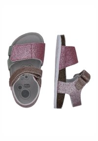 Sandali glitterati per bambini con applicazioni rosa, verdi e marroni, chiusure regolabili in velcro e soletta imbottita. Suola bianca con dettagli testurizzati.